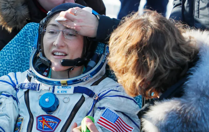Astronaut floating in zero gravity with Earth in the background, representing effects of space travel on the human body