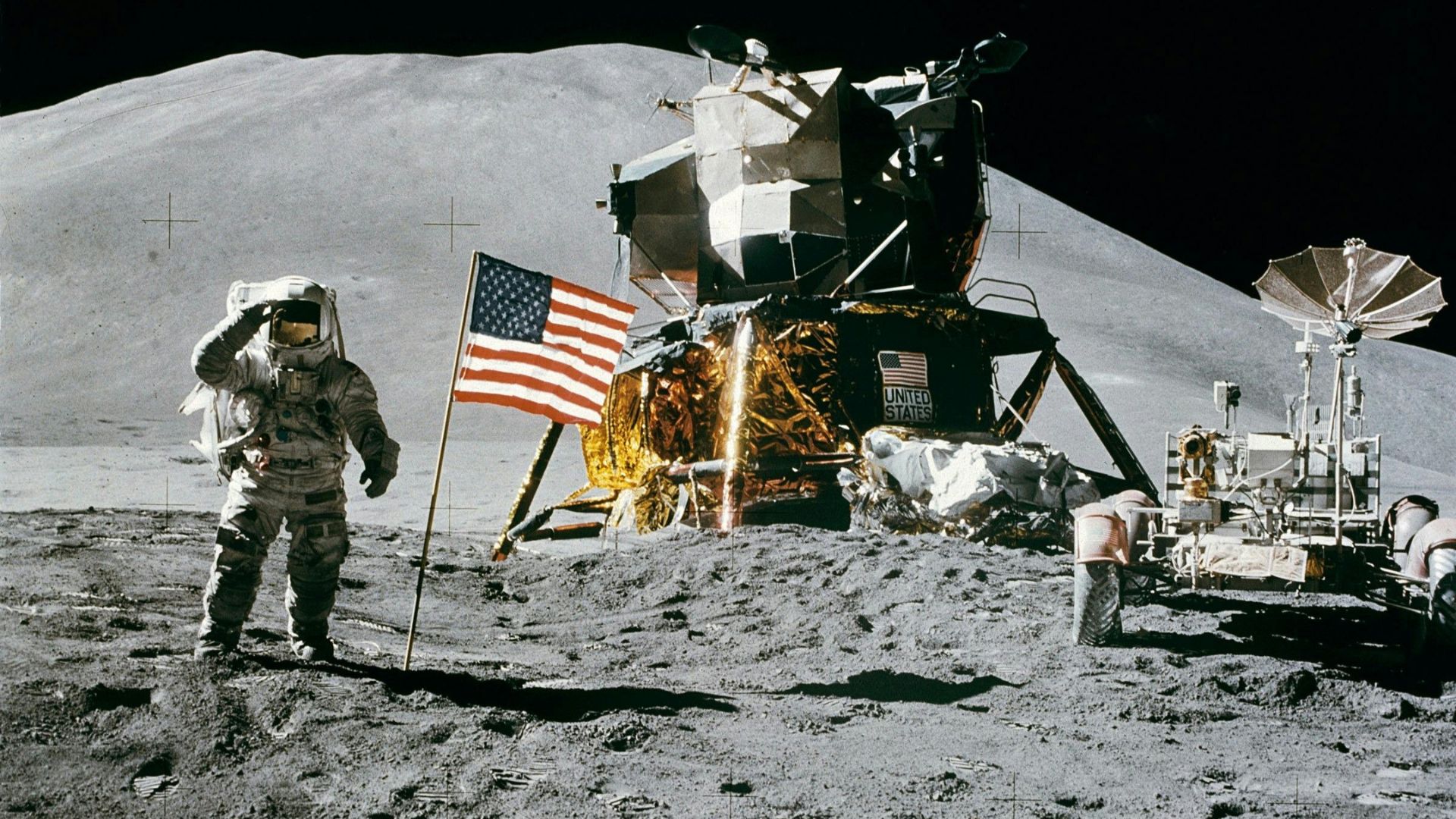 Astronaut standing beside the American flag on the Moon, symbolizing the physical limits of the human body during long-term space travel