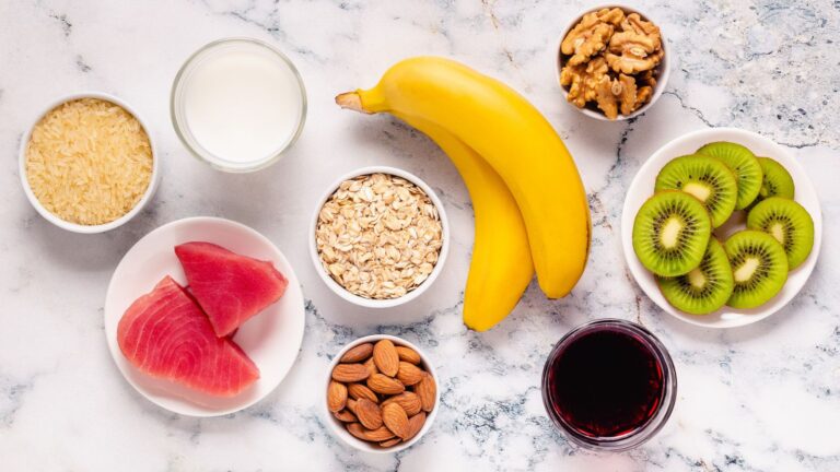 A variety of sleep-friendly foods like almonds, cherries, and herbal tea for better sleep